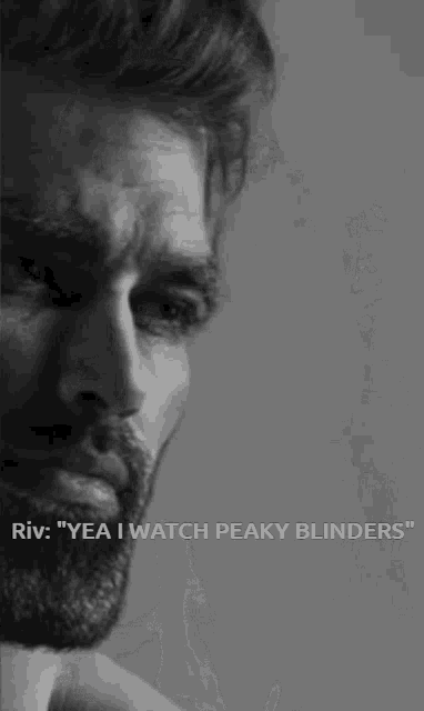 a black and white photo of a man with a beard with the caption " riv yea i watch peaky blinders "