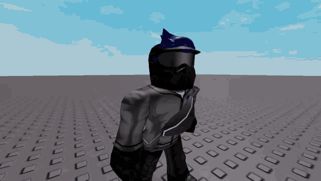 a person wearing a helmet and goggles is standing on a gray surface