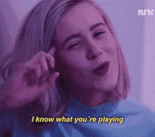 a woman in a blue sweater says i know what you 're playing .