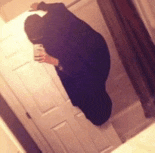 a person is taking a selfie in a bathroom mirror