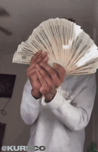 a person holding a fan of money in front of their face with the hashtag @kurrico on the bottom
