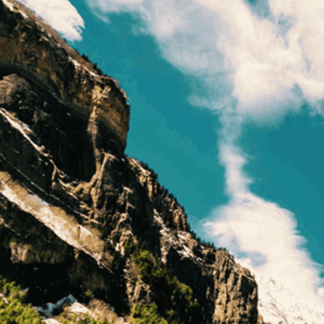 a mountain with a blue sky behind it