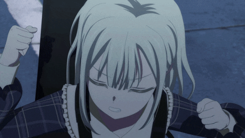 a girl with white hair has her eyes closed and her fist up
