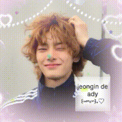 a young man with a sign that says jeongin de ady