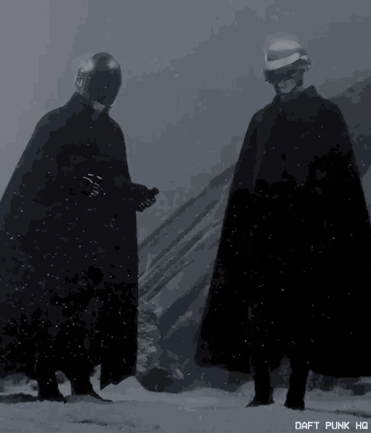 a couple of people standing in the snow with daft punk hq written on the bottom right