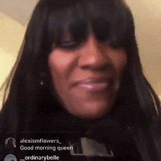 a close up of a woman 's face with the words good morning queen on the bottom