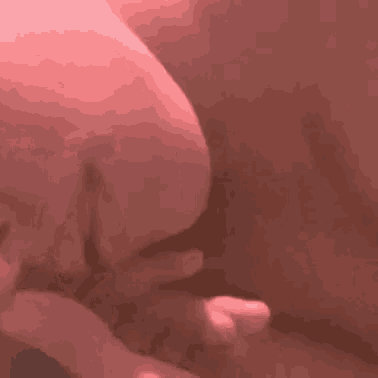 a close up of a person 's hand holding another person 's finger .