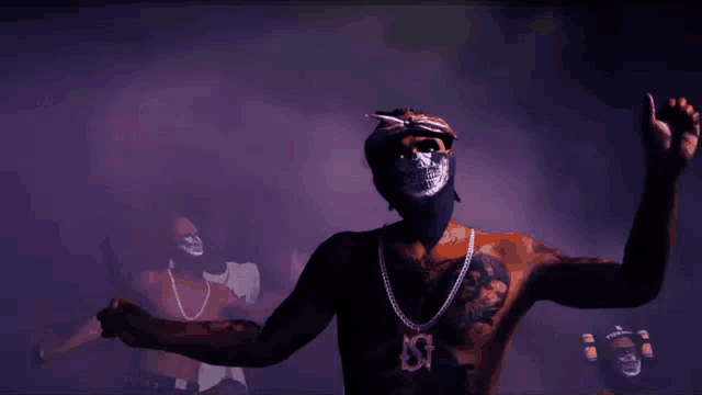 a man wearing a bandana and a necklace with a pendant that says ' ss ' on it