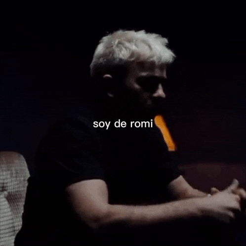 a man with the word soy de romi written on the bottom