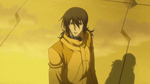 a man in a yellow jacket is standing in front of a yellow wall