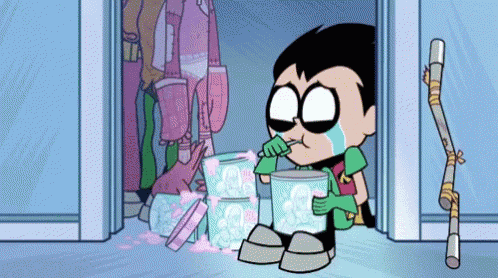 robin from teen titans go crying while holding a bucket