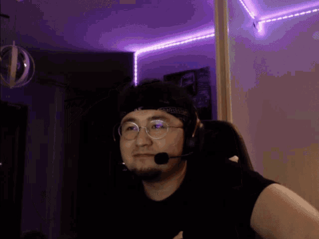a man wearing glasses and a headband that says nc