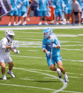 a lacrosse player wearing a jersey that says new york is running on the field