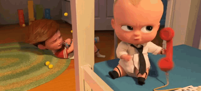 a cartoon baby is sitting on a bed holding a red phone