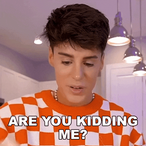 a man wearing an orange and white checkered sweater says are you kidding me ?
