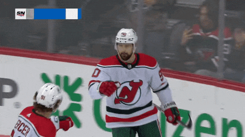 a hockey player wearing a jersey with the number 0 on it
