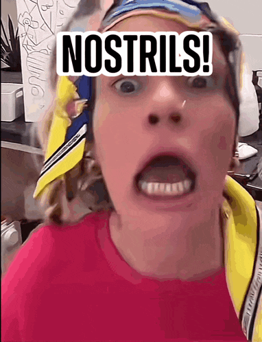 a woman with a scarf around her head is making a funny face and says nostrils