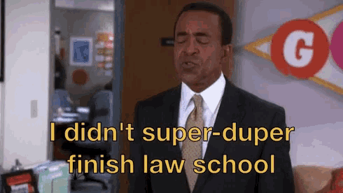 a man in a suit and tie is saying that he did n't super-duper finish law school .