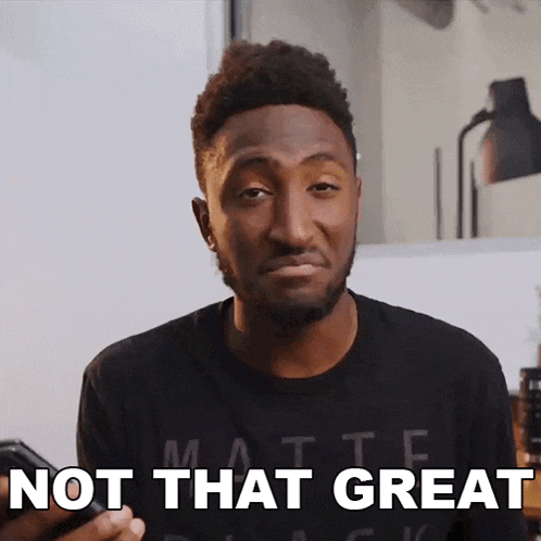 a man wearing a black shirt with the words not that great on it