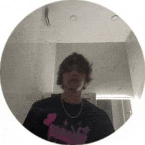 a young man is standing in front of a mirror in a bathroom .