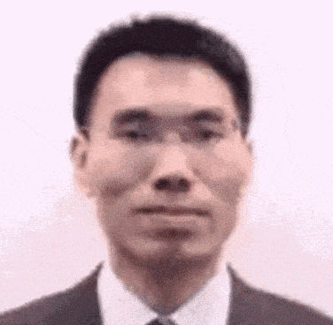 a man in a suit and tie is making a face .