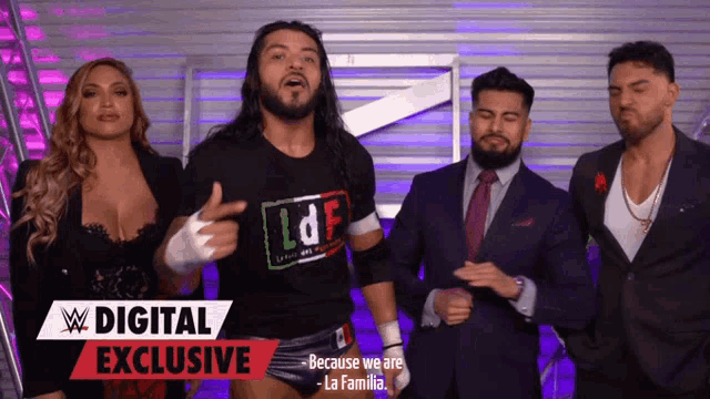 a group of people standing next to each other with a sign that says digital exclusive