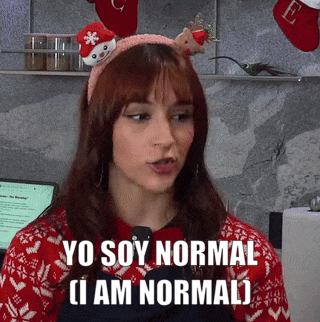 a woman wearing a headband that says yo soy normal