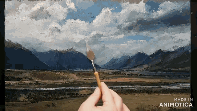 a hand holding a brush in front of a painting made in animotica