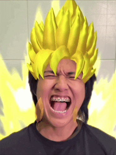a man with braces on his teeth is wearing a yellow wig on his head