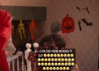 a man standing in front of a wall with a sign that says even they were weirded tf out on it