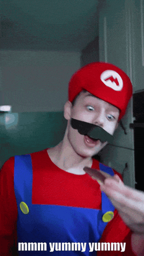 a man in a mario costume eating a piece of food
