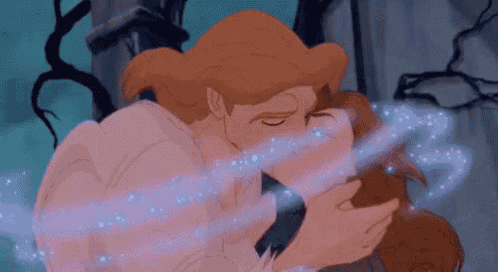 a man and a woman are kissing in a cartoon scene from the movie beauty and the beast .