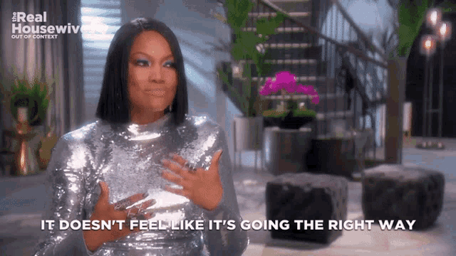 a woman in a silver sequined dress says it doesn 't feel like it 's going the right way