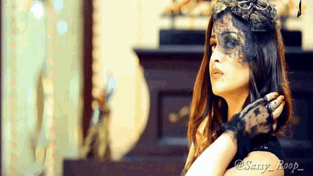 a woman wearing a lace mask and gloves has the name sassy roop on the bottom right