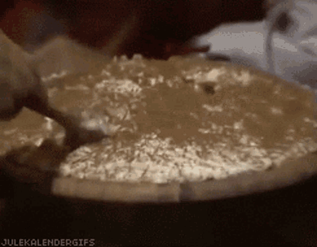 a close up of a bowl of food with the words julekalendergifs at the top