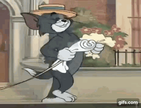 tom from tom and jerry is holding a bouquet of flowers while wearing a hat and apron .