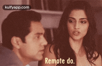 a man and a woman are talking and the woman is saying remote do