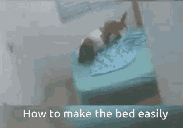 a person is laying on a bed with the words how to make the bed easily above them