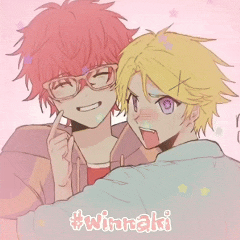 a couple of anime characters standing next to each other . one of the characters is wearing a reindeer hat .