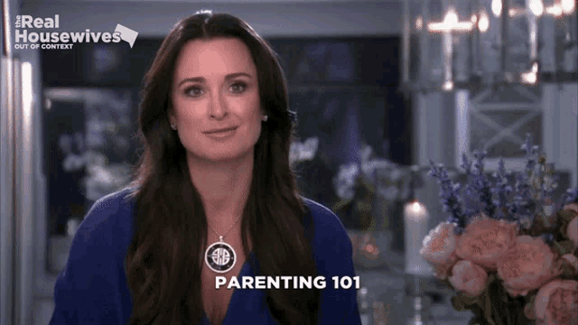 a woman stands in front of a bouquet of flowers and says parenting 101