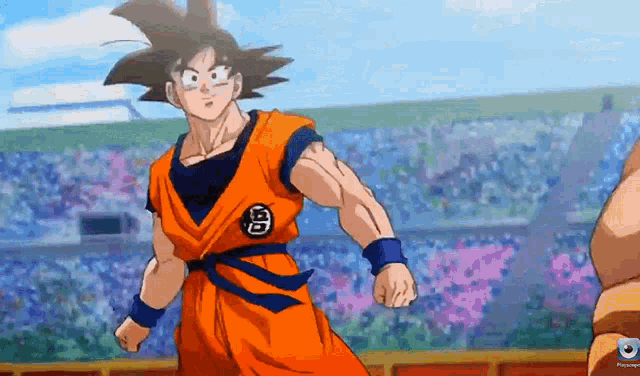 goku from dragon ball z is standing in front of a crowd of people .