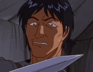 a man is holding a sword in front of his face