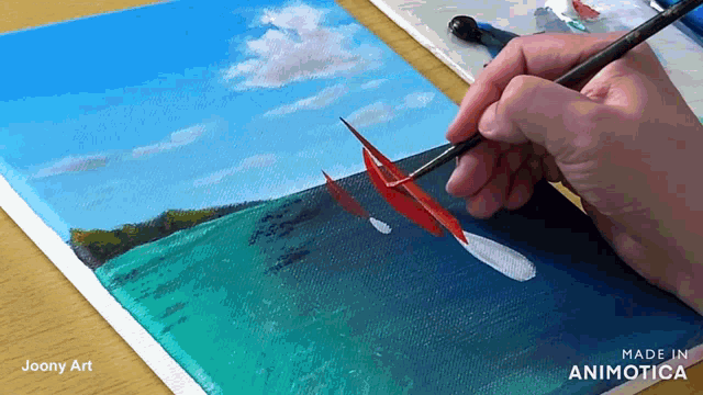a person is painting a landscape on a canvas with the words made in animatica visible