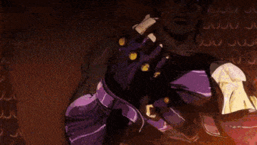 a man in a purple shirt and gloves is making a stop gesture with his hands .