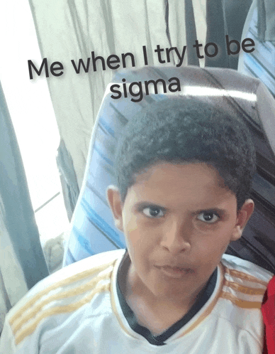 a young boy sitting in a chair with the words me when i try to be sigma written above him