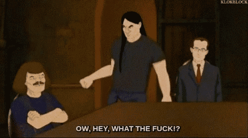 a group of men are sitting at a table and one of them is saying `` ow , hey , what the fuck ! ''