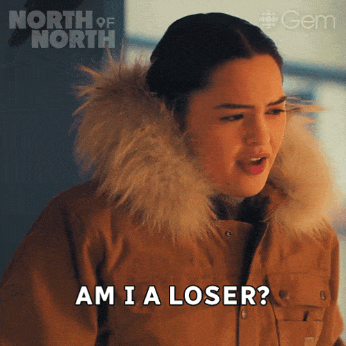 a woman says am i a loser in front of a poster for north of north