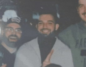 a group of men are posing for a picture and one of them is wearing a green shirt that says par