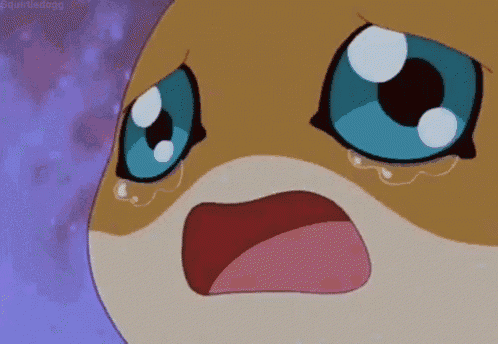 a close up of a cartoon character with blue eyes crying with tears running down its face .