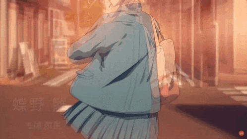 a girl in a school uniform walking down a street
